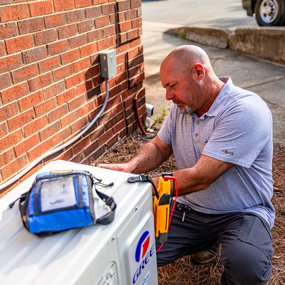 AC being cleaned